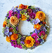 Floral wreath of dahlias, zinnias, hydrangeas, liver balsam and verbena in bright summer colours