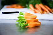 Peeled baby carrots with green