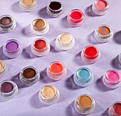 Eye shadow makeup in round glass containers