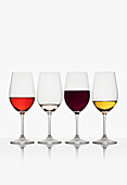 Glasses of red, white and rose wine on white background