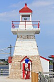 Canada, New Brunswick, Acadie, Bouctouche, Pays de la Sagouine, a tourist park inspired by the novel by Antonine Maillet La Sagouine and founded in 1992, lighthouse