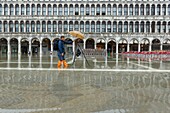 Italy, Veneto, Venice listed as World Heritage by UNESCO, San Marco district, facade of Procuratie Vecchie and terrace of Gran Cafe Cuadri on Saint Marc square during acqua alta