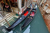 Italy, Veneto, Venice listed as World Heritage by UNESCO, San Marco district, gondolas moored at Punte dei Ferali on Rio dei Ferali and facade of the Anima Bella restaurant