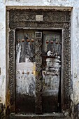 Tanzania, Zanzibar Town, Stone Town, listed as World Heritage by UNESCO, traditional door with carved framing
