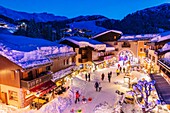 France, Savoie, Valmorel, Massif of the Vanoise, Tarentaise valley, the street Du Bourg with a view of the Cheval Noir (2832m)