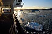 Greenland, west coast, Disko Bay, Hurtigruten's MS Fram Cruise Ship moves between Icebergs in Quervain Bay