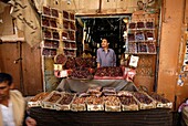 Yemen, Sana & 2bd;a Governorate, Sanaa, Old City, listed as World Heritage by UNESCO, Souk Al Milh, man with a market stall