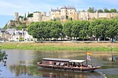 France, Indre et Loire, Loire Valley listed as World Heritage by UNESCO, Chinon, traditional Ligerien boat trip (toue cabanee) on the Vienne river at the foot of the castle