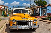 Cuba, Pinar del Rio province, Vinales, Vinales Valley, Vinales National Park listed as World Heritage by UNESCO, old american car on a street