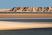 Morocco, Western Sahara, Dakhla, site of the white dune standing between lagoon and mountains