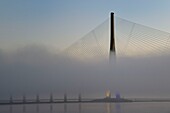France, between Calvados and Seine Maritime, the Pont de Normandie (Normandy Bridge) in the mists of dawn, it spans the Seine to connect the towns of Honfleur and Le Havre