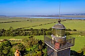 France, Eure, Marais Vernier region, Natural Reserve of the Seine estuary, Saint Samson de la Roque, Roque lighthouse on Pointe de la Roque overlooks the Seine river estuary, the Normandy bridge far in the background (aerial view)