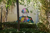 France, Paris, mural painting representing of a monk meditating in a small garden at the corner of rue d'Aboukir and rue des Petits Carreaux