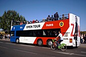 France, Paris, area listed as World Heritage by UNESCO, Double decker tourist bus on the banks of the Seine