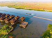 Myanmar (Burma), Shan State, Inle Lake, Kela Floating Gardens and the Paramount Inle hotel with bungalows on stilts (aerial view)