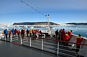Greenland, West Coast, Disko Bay, Hurtigruten's MS Fram Cruise Ship moves Between Icebergs in Quervain Bay, the Kangilerngata sermia on the left and the Eqip Sermia Glacier (Eqi Glacier) on the right