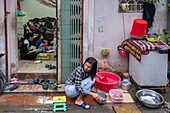 Vietnam, Hanoi, railroad that passes in the heart of the old town, the inhabitants of the neighborhood use this space until the last moment before the passage of a train