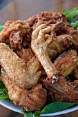 Vietnam, Lao Cai province, Sa Pa town, grilled chicken legs