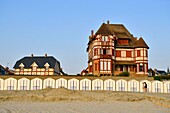 France, Somme, Baie de Somme, Le Crotoy, Belle-Epoque villa and beach cabines along Jules-Noiret promenade
