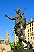 Spain, Aragon, Zaragoza, statue of Cesar Augustus and the leaning bell tower of the church of San Juan de Los Panetes