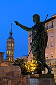 Spain, Aragon, Zaragoza, statue of Cesar Augustus and the leaning bell tower of the church of San Juan de Los Panetes