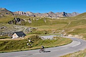 France, Savoie, Valloire, massif des Cerces, cycling ascension of the Col du Galibier, one of the routes of the largest cycling area in the world, In the background on the right the pass, from the hamlet of Les Granges