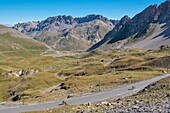 France, Savoie, Massif des Cerces, Valloire, cycling climb of the Col du Galibier, one of the routes of the largest cycling area in the world, last kilometer before the summit and rock of the great Pare