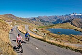 France, Savoie, Saint Jean de Maurienne, the largest bike trail in the world was created within a radius of 50 km around the city. under the Iron Cross Pass, view of cyclists and Lake Laitelet and the needles of Arves