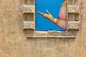 Italy, Tuscany, Siena, historical center listed as World Heritage by UNESCO, facade of Santa Maria della Scala museum, detail of a poster
