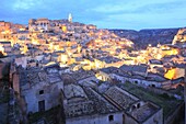 Italy, Basilicata, Matera, European Capital of Culture 2019, troglodyte old town listed as World Heritage by UNESCO, Sassi di Matera, Sasso Caveoso with its cathedral (left) and the Monterrone complex (right)