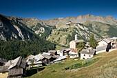France, Hautes Alpes, Queyras massif, Saint Veran, the village and the crest of the Arnaude valley (2800m)