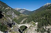 France, Hautes Alpes, Briancon, the bridge of Asfeld makes it possible to cross the Durance, in the distance Mont Chaberton (3131m) and the castle top Jouan (2565m)