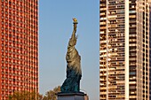 France, Paris, the banks of the Seine, the buildings of the Beaugrenelle district, the island of the swans with the Statue of Liberty