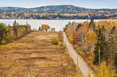 Canada, New Brunswick, Bay of Fundy, Bayside, elevated view of country road and house, autumn