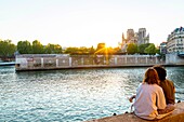 France, Paris, area listed as World heritage by UNESCO, Saint Louis Island, Orleans Pier at sunset