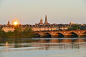 France, Gironde, Bordeaux, area listed as World Heritage by UNESCO, Pont de Pierre on the Garonne River, Pey-Berland tower and Saint Andre cathedral