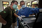 Indonesia, Sumatra, SOCP Quarantine Center, rescuing orangutans in difficulty by Dr. Andreas Messikommer, Swiss surgeon specialized in orthopedic and traumatological surgery, before socialization and reintroduction into their natural environment