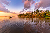 View of Case Noyale at sunset, Le Morne, Riviere Noire District, Mauritius, Indian Ocean, Africa