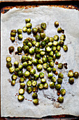 Overhead view of baked brussel sprouts on baking paper