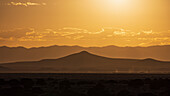 USA, New Mexico, Santa Fe, Desert landscape at sunset during heat wave