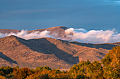 USA, Idaho, Bellevue, Clouds rolling over foothills in autumn