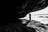 South Africa, Hermanus, Teenage girl (16-17) exploring Klipgat Caves in Walker Bay Nature Reserve