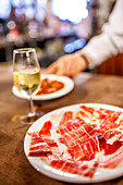 Glass of Fino and Iberian Ham at a Sevilla Tavern