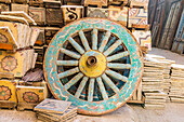 Old Cairo, Cairo, Egypt. Wooden cart wheel and floor tiles in an alley in Cairo.