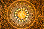 The ceiling of the men's prayer room in the Sultan Qaboos Grand Mosque, Muscat, Oman.