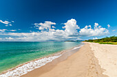 The miles long Pinney's Beach fronting the Caribbean Sea. Nevis, Saint Kitts and Nevis, West Indies.