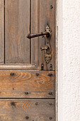 Aigues-Mortes, Gard, Occitania, France. An old wooden door in the south of France.