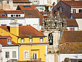 Rooftops of the town of Coimbra and the old bell tower of St. Bartholomew church.
