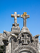 Cross at the top of an ancient gravestone in the cemetery at the Castelo de Ourem, a Portuguese National Monument.