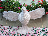 A white dove made of feathers, symbolizing the Holy Spirit. Festa dos Tabuleiros is one of the most important celebrations in Portugal.